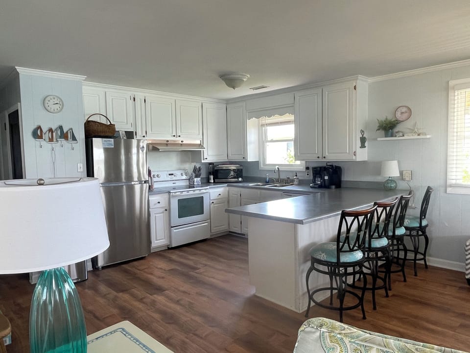Fully stocked kitchen with sound views and open to living & dining areas.