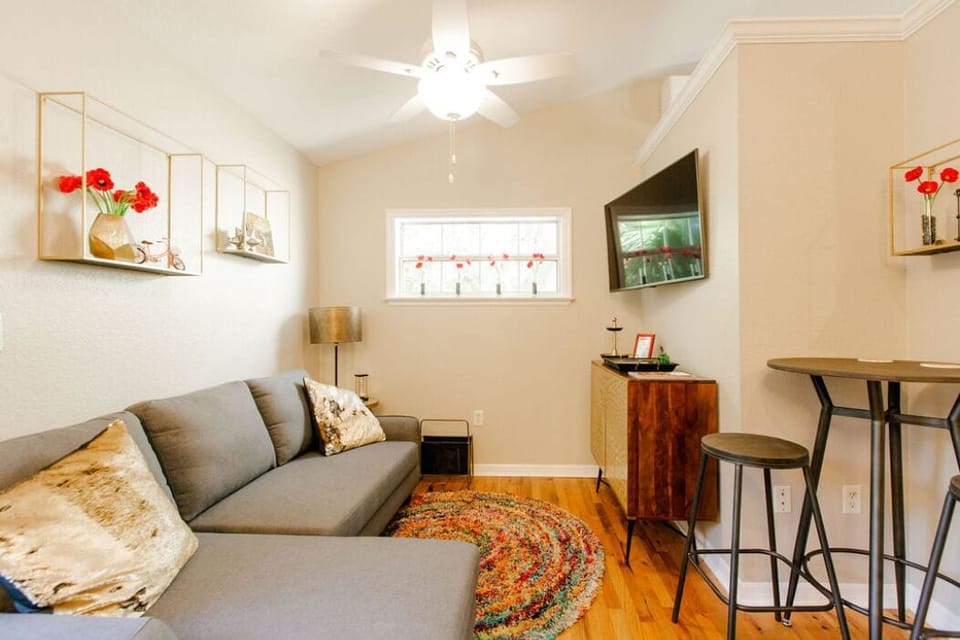 Comfy living room with big screen tv and dinette table with two chairs
