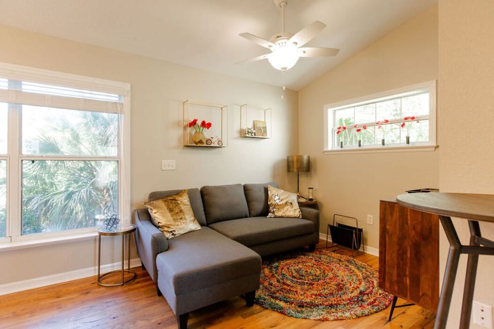 Comfy living room with big screen tv and dinette table with two chairs