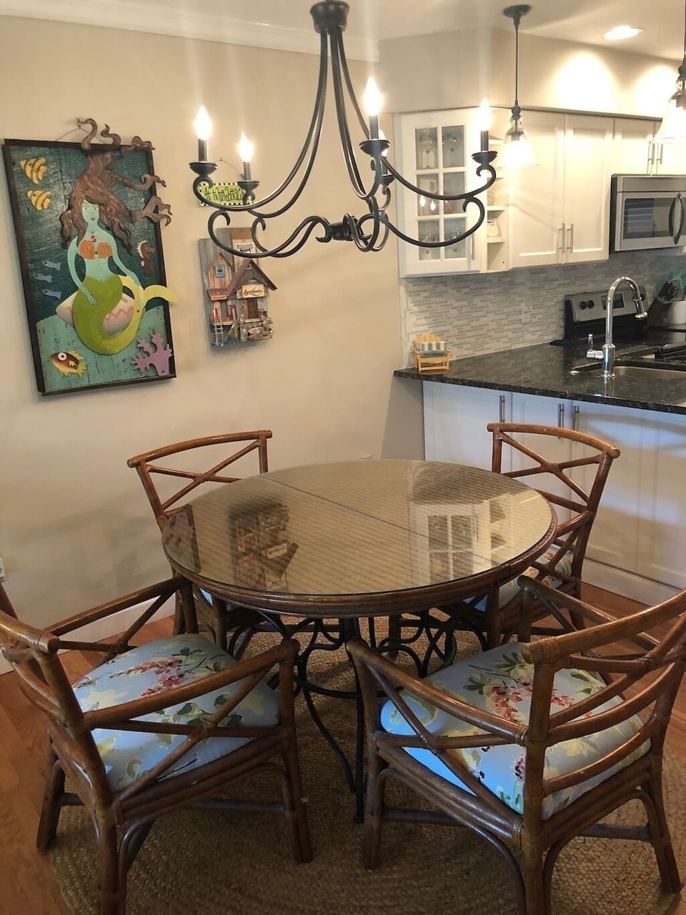 Kitchen table sits in between the kitchen and the living area space.