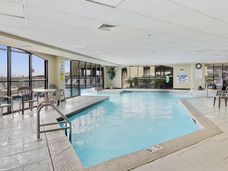 Indoor portion of the indoor/outdoor pool with a hot-tub