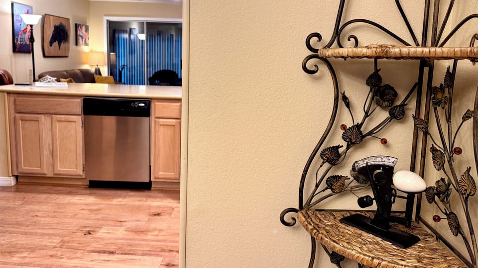 Welcome kitchen glimpse: corian counter, appliances, unique rustic decor