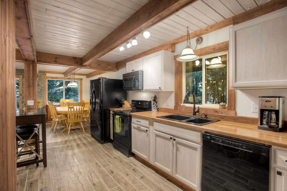 Wood beams, flooring and accents for authentic cabin environment right as you step in
