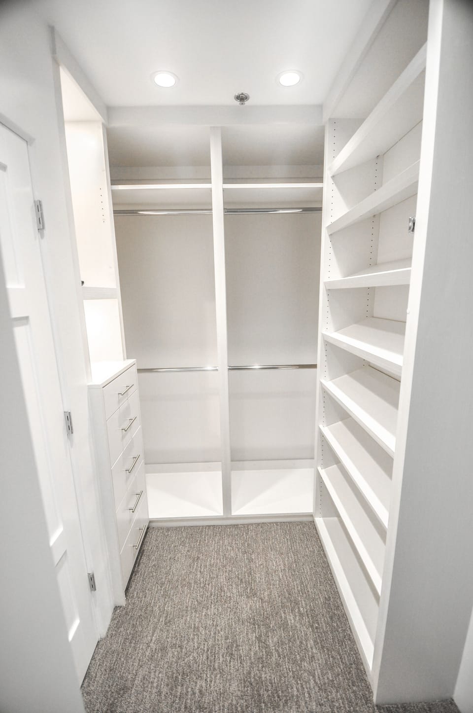 Full size walk in closet with drawers and shelving for easy organization!