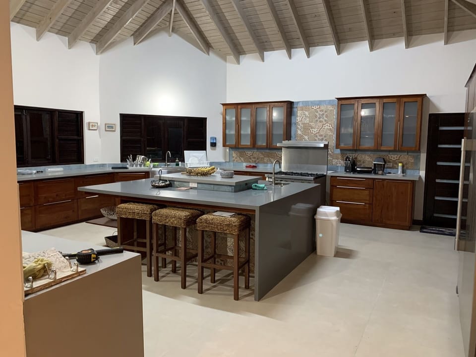 Professional kitchen where your private chef prepares meals to your preferences.