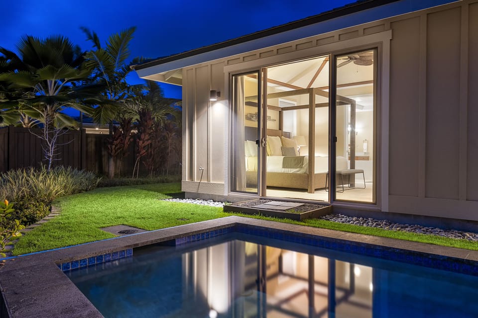 Nighttime view of the sliding glass door leading into the Primary bedroom.