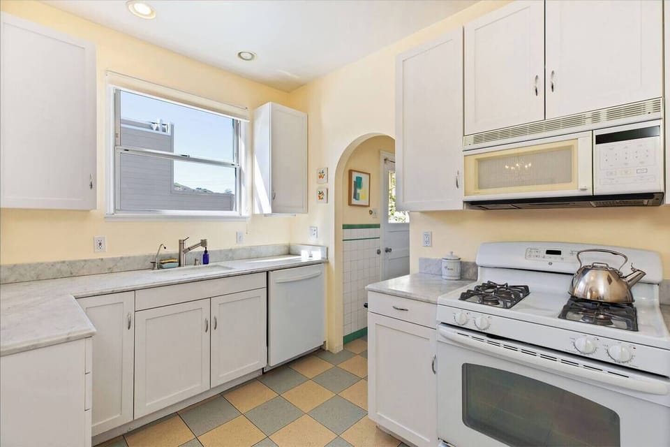 Kitchen with exterior view and door to back porch