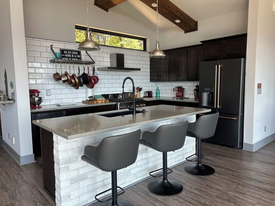 The spacious, gourmet open-concept kitchen is perfect for gathering.