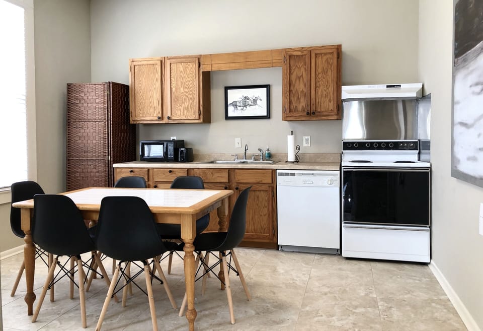 Full kitchen w/ plates/silverware, wine glasses, Keurig w/ coffee provided