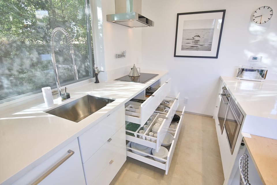 Fully stocked kitchen featuring Alessi goods.