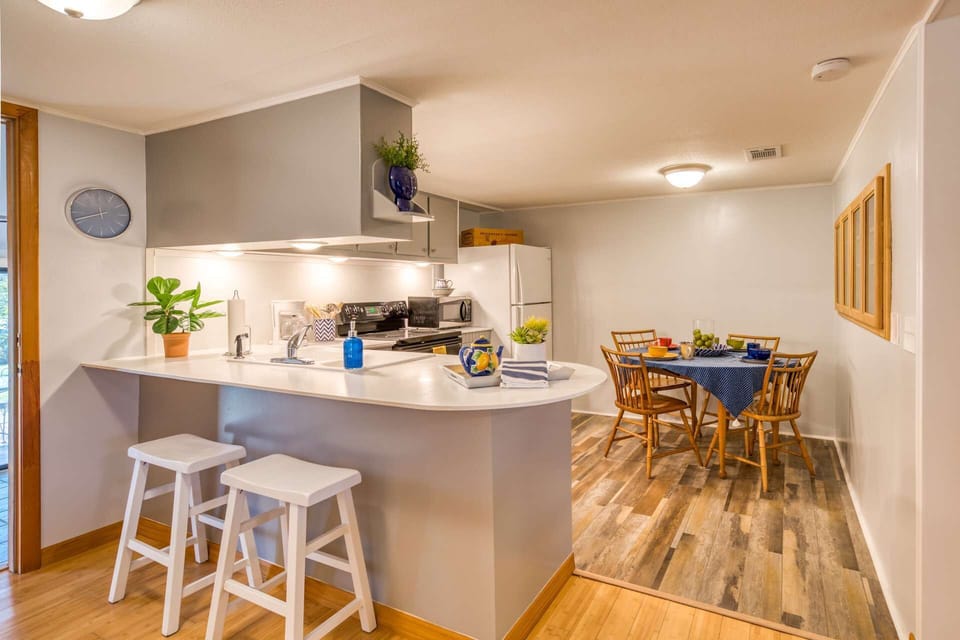 The kitchen is neat, clean and well-stocked with all you need to "cook at home."