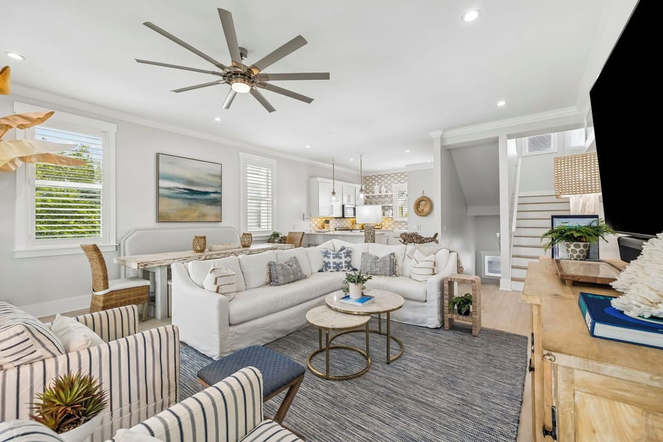 Your bright, breezy living space welcomes you with plush seating, coastal décor, and an airy open layout—perfect for unwinding or gathering with loved ones after a day of adventure.