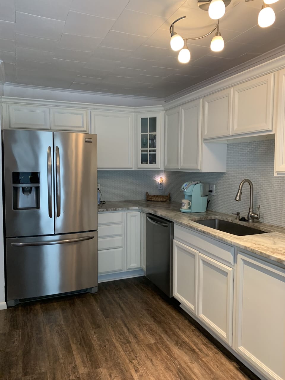 Large kitchen with the coolest table you'll ever find!  