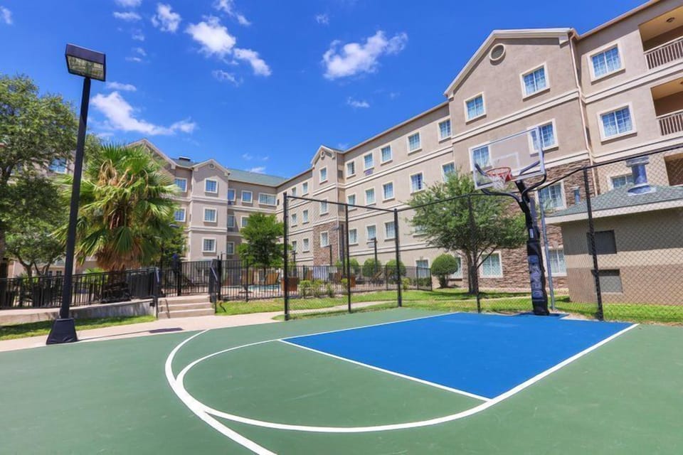 Basketball court next to the building.