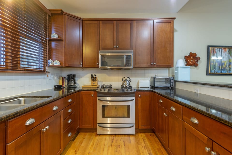 Kitchen with dishwasher & Drip-style coffeemaker.