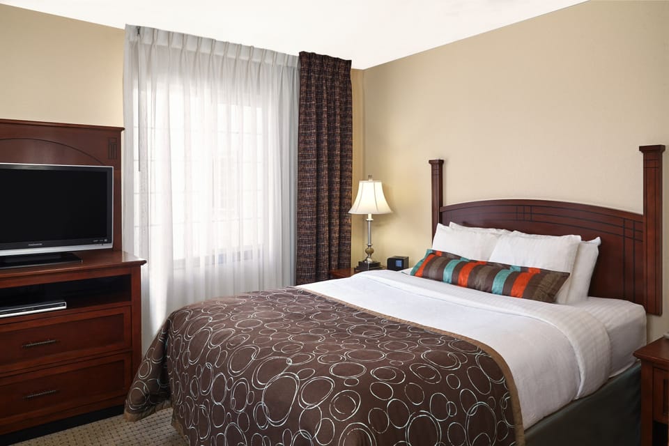 Drift to sleep in a comfortable bed after a busy day.