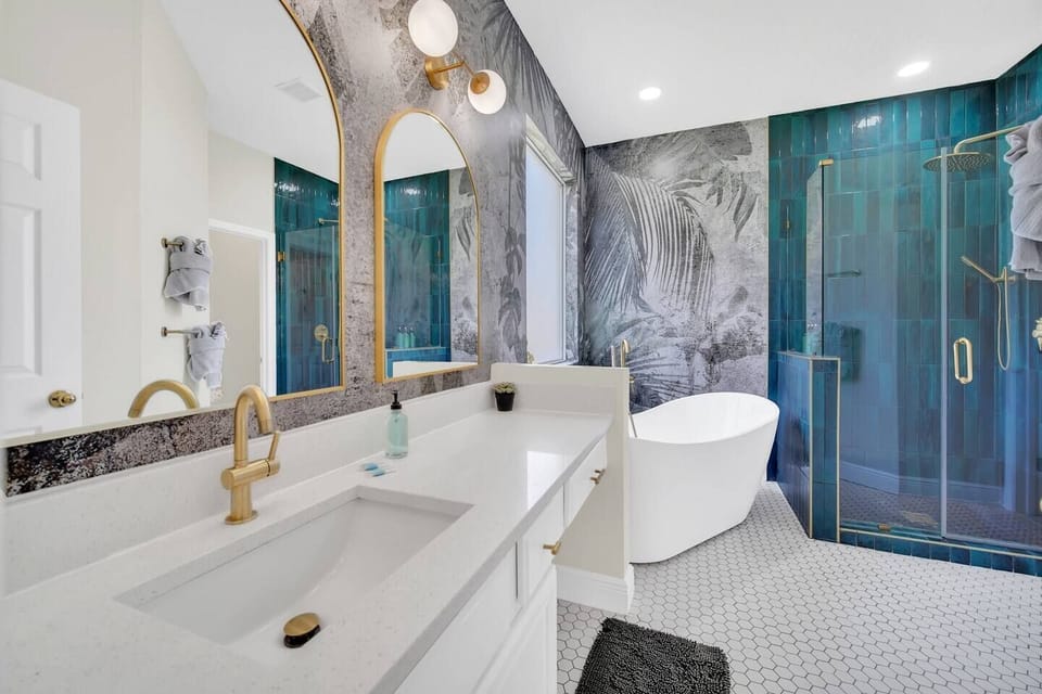 NEW Bathroom remodeled in December 2022!  Beautiful custom tiling, luxurious rainfall shower head with handheld spray, modern soaker tup with handheld spray, private toilet room with its own bluetooth bathroom fan light!  