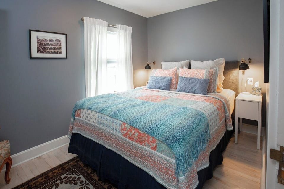 Queen size bed in a private room.