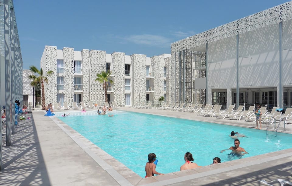 Dive into the outdoor pool on a hot summer day.