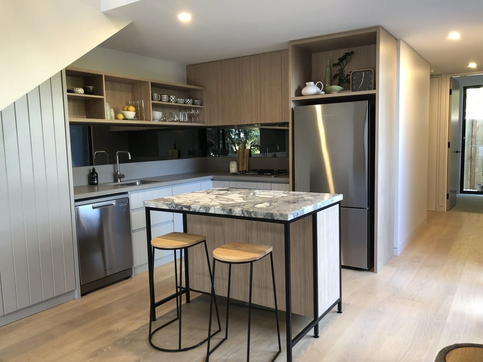 Meile cooktop, and designer appliances with marble island bench