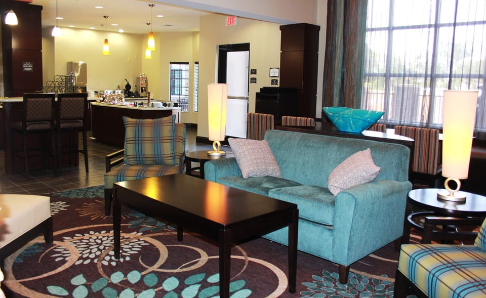 Lounge area with soft seating and refreshment station.