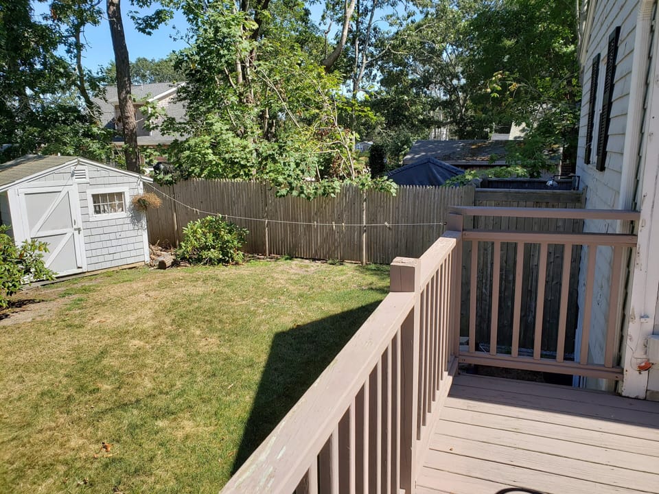 Side yard which includes shed, outdoor shower, and clothes line. 