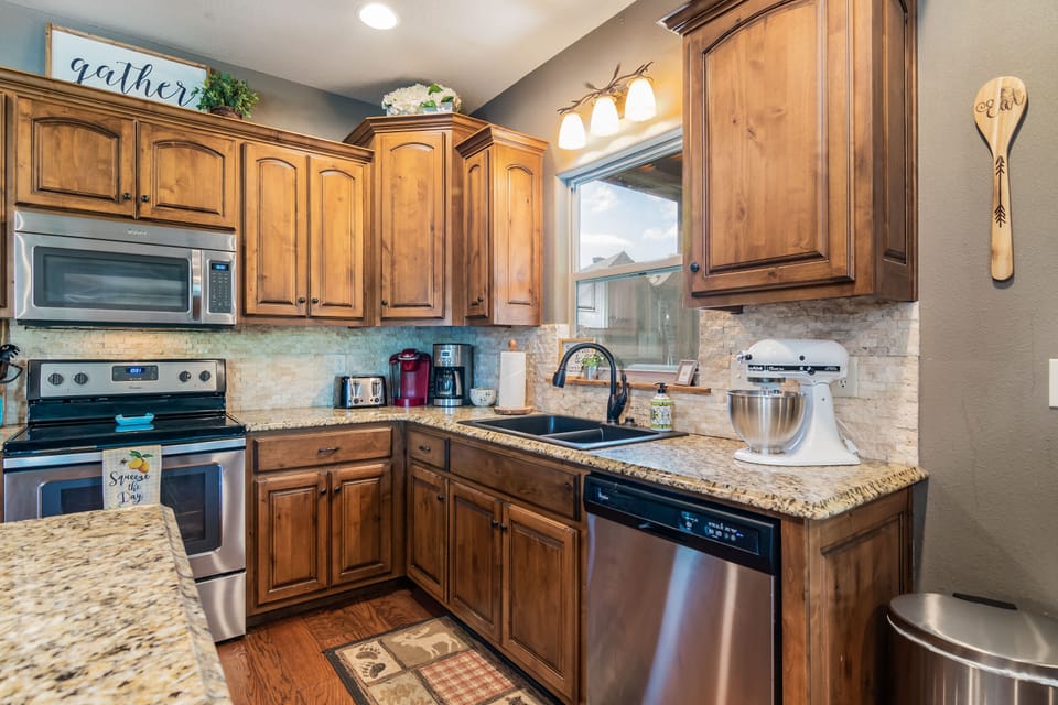 A regular coffee pot, Keurig, and Kitchen Aid mixer complete the kitchen!