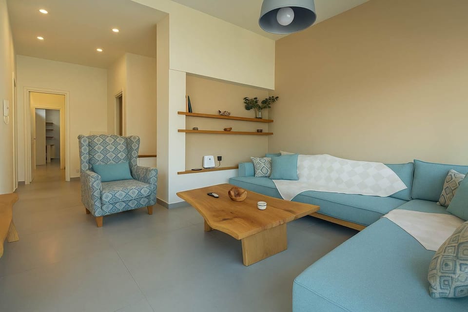 Relax on the Cozy Lounge Area with Comfortable Sofas and Warm Lighting