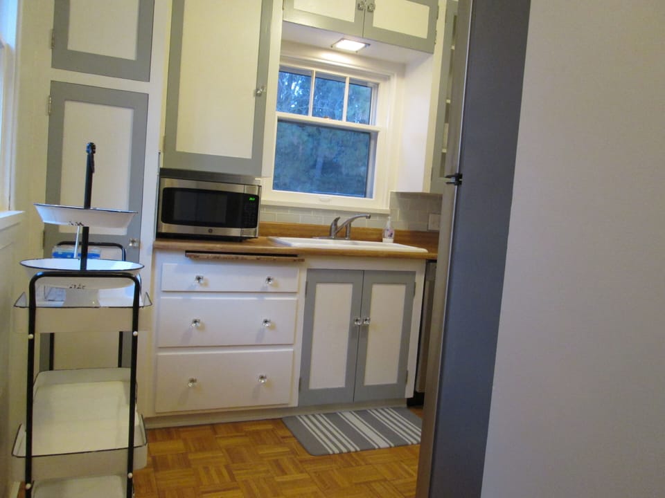 Kitchen includes microwave and plenty of drawer space.