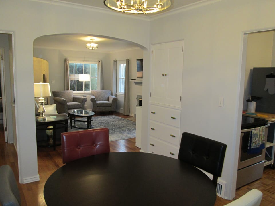 The view from the dining room into the living room.