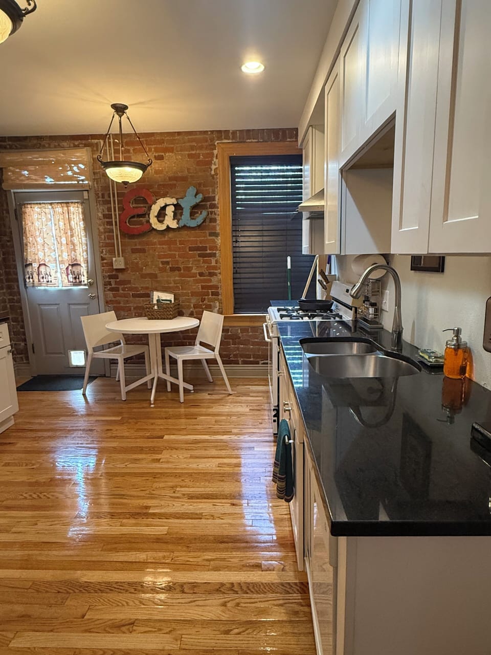 Kitchen gas range with hood, high powered AC unit and air purifier.