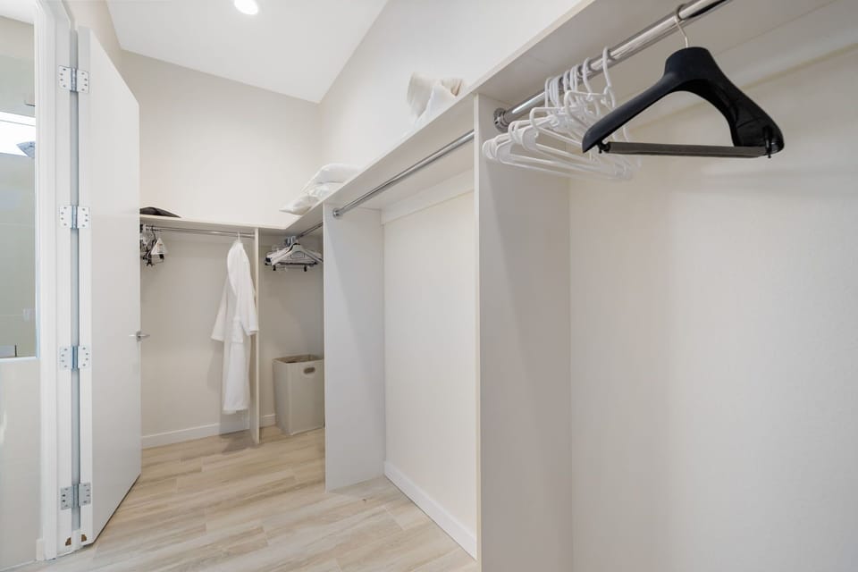 Huge walk in closet in primary bedroom.