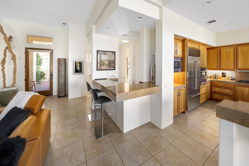 Great room area with wet bar in center.