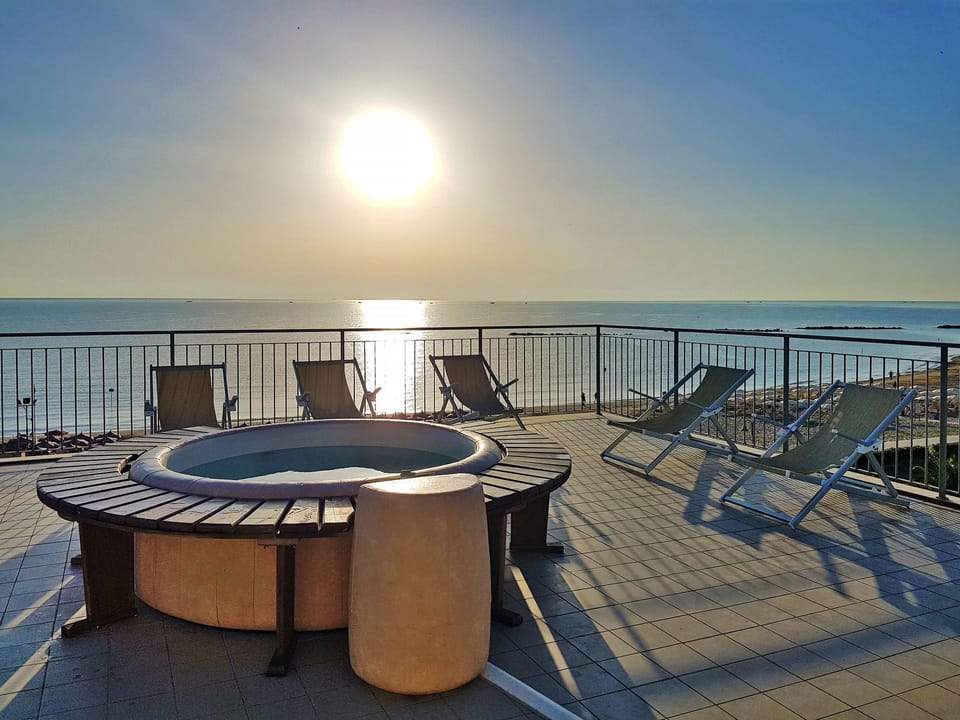Property, Sky, Table, Real Estate, Architecture, Furniture, Roof, Deck, Sea, House