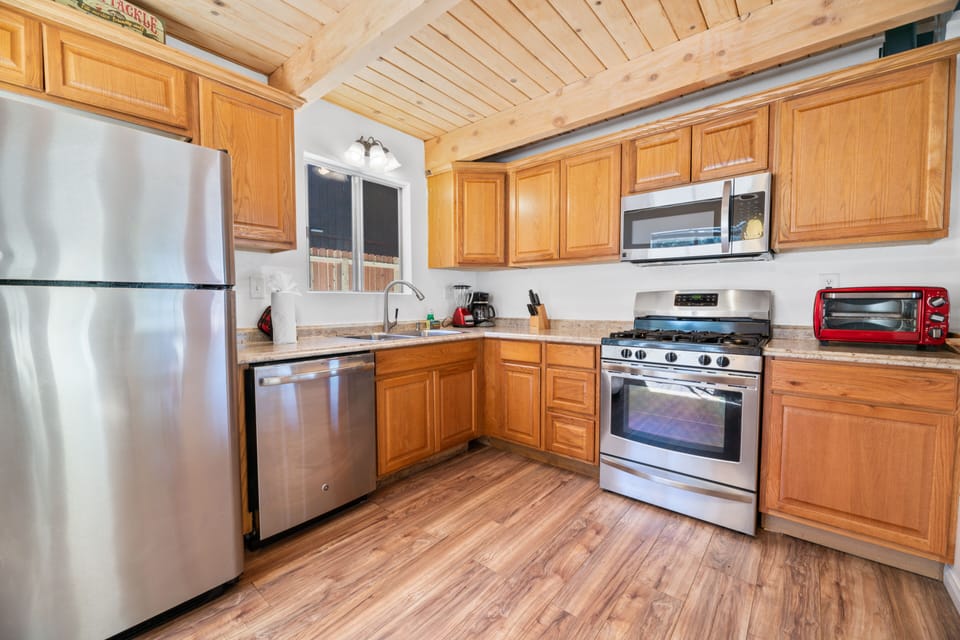 Adorable open kitchen! - Adorable open kitchen with updates appliances, bar seating and a dining table.