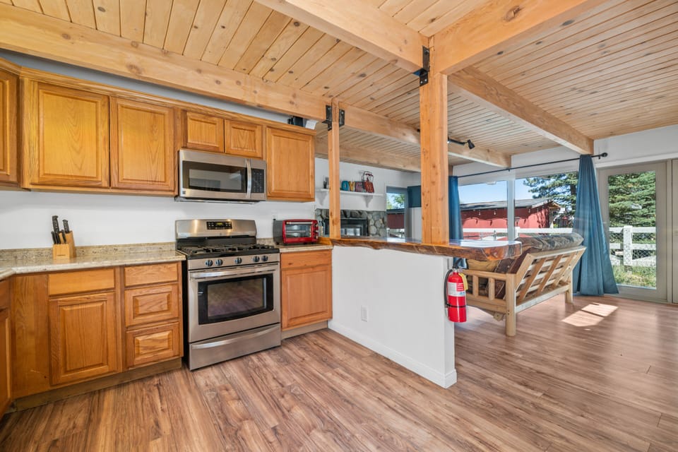 Adorable open kitchen! - Adorable open kitchen with updates appliances, bar seating and a dining table.