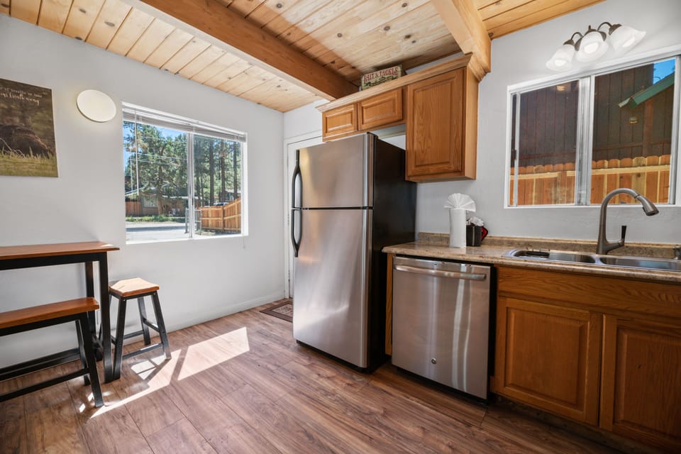 Adorable open kitchen! - Adorable open kitchen with updates appliances, bar seating and a dining table.