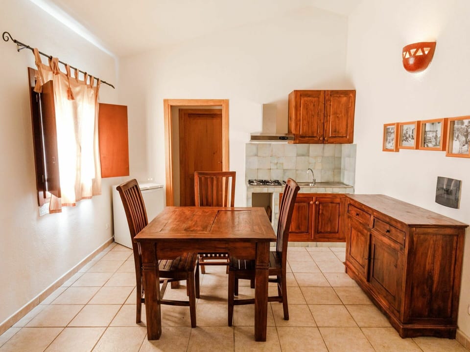 Table, Furniture, Property, Cabinetry, Chair, Wood, Picture Frame, Lighting, Interior Design, Drawer