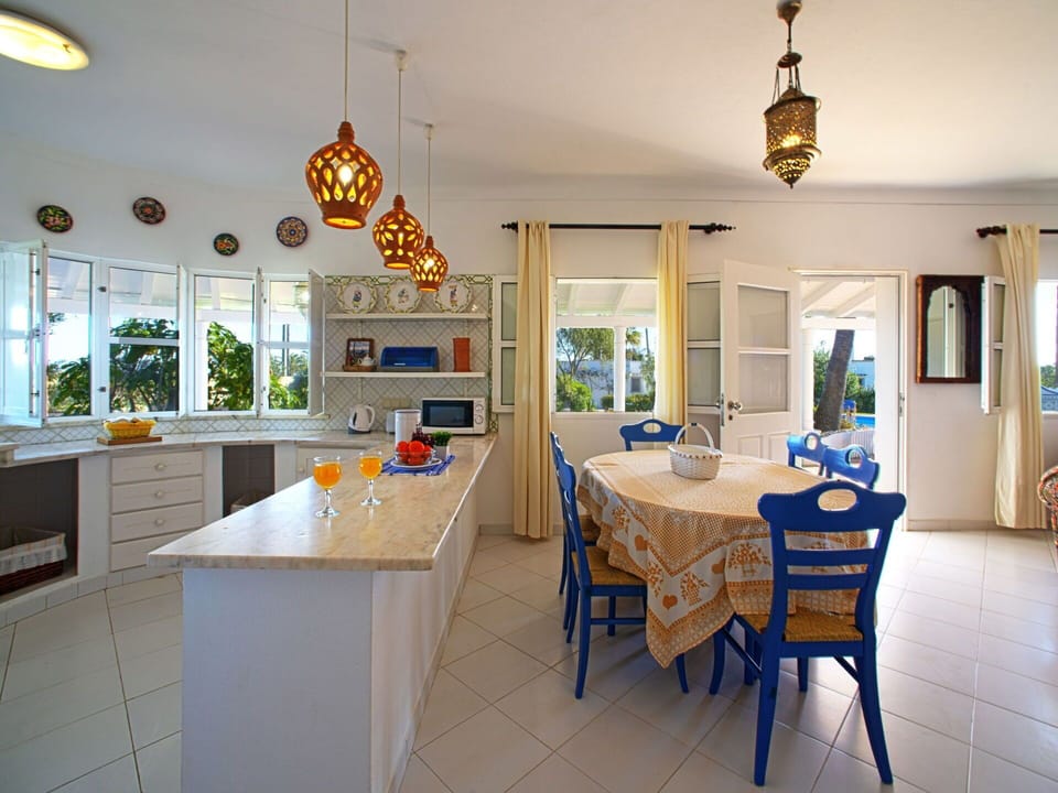 Table, Furniture, Property, Cabinetry, Countertop, Chair, Wood, Interior Design, Lighting, Architecture