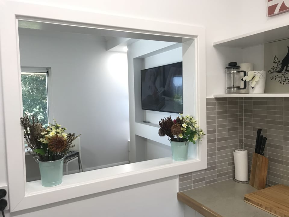 Window from kitchen to living space