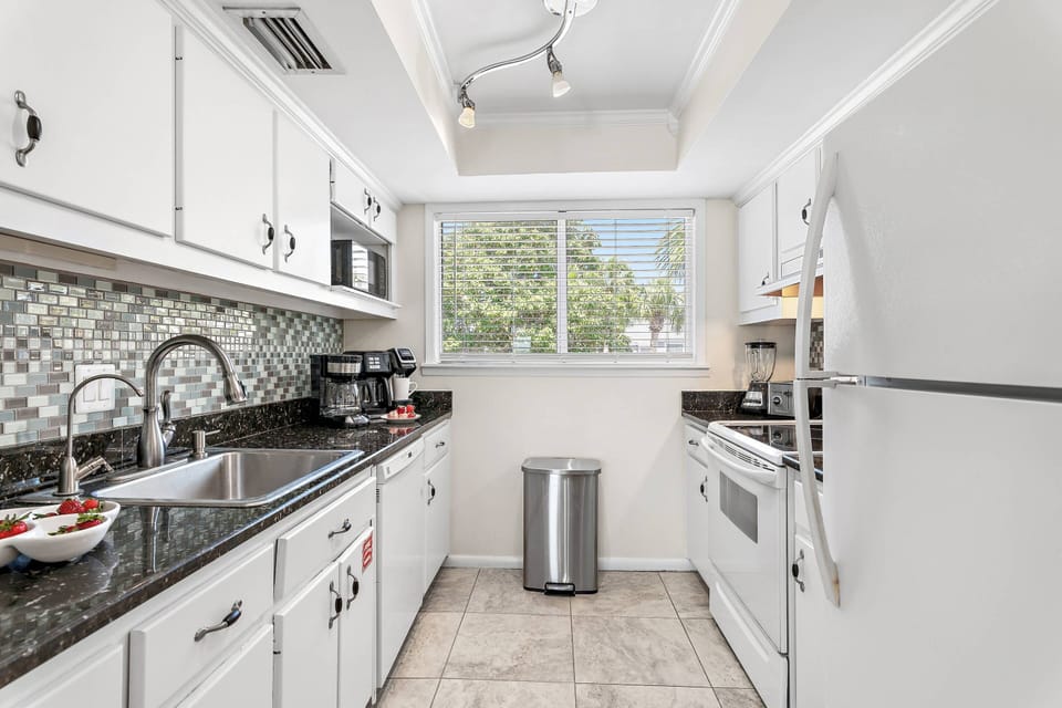 Bright Clean Kitchen with Refrigerator, Dishwasher, Stovetop, Oven & Microwave