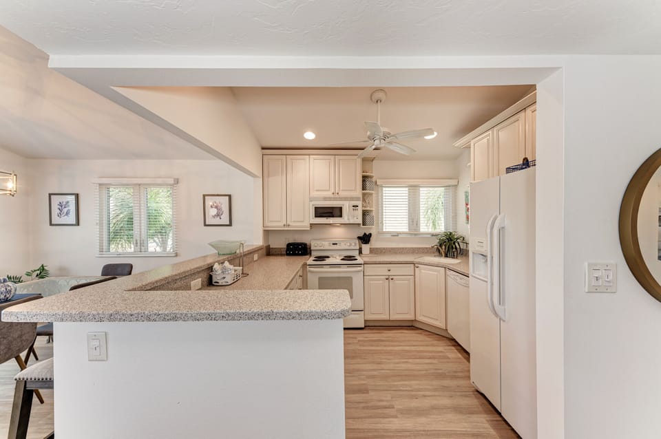 Well equipped kitchen is bright and cheery. 