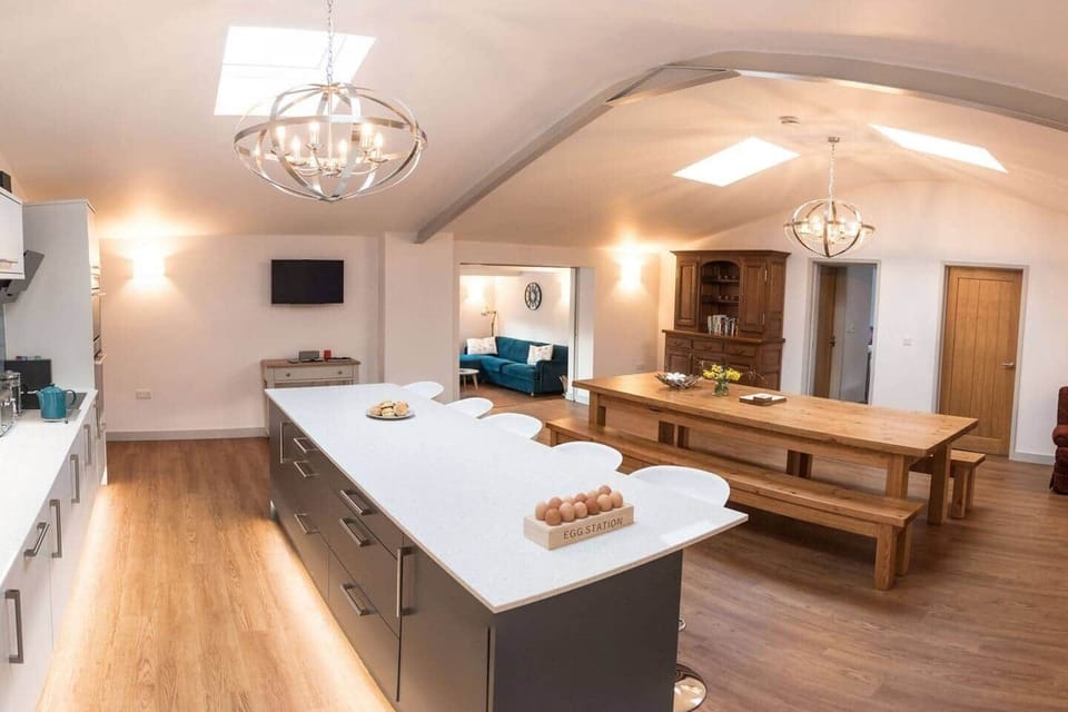 Kitchen Diner and small seating area.  Access to all four bedrooms and the lounge.