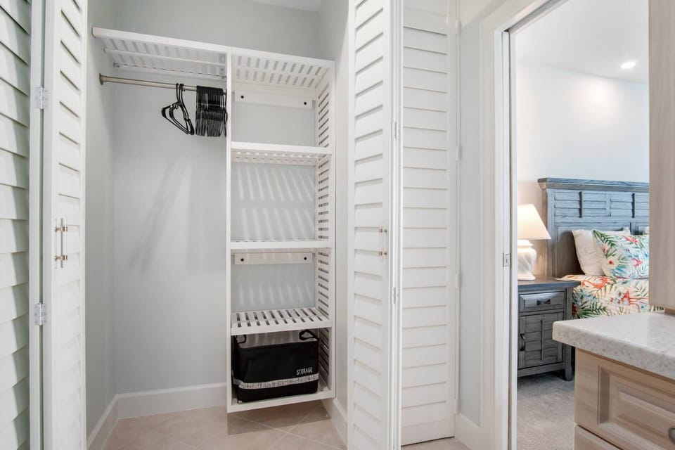 The primary ensuite bathroom includes a very functional closet area.