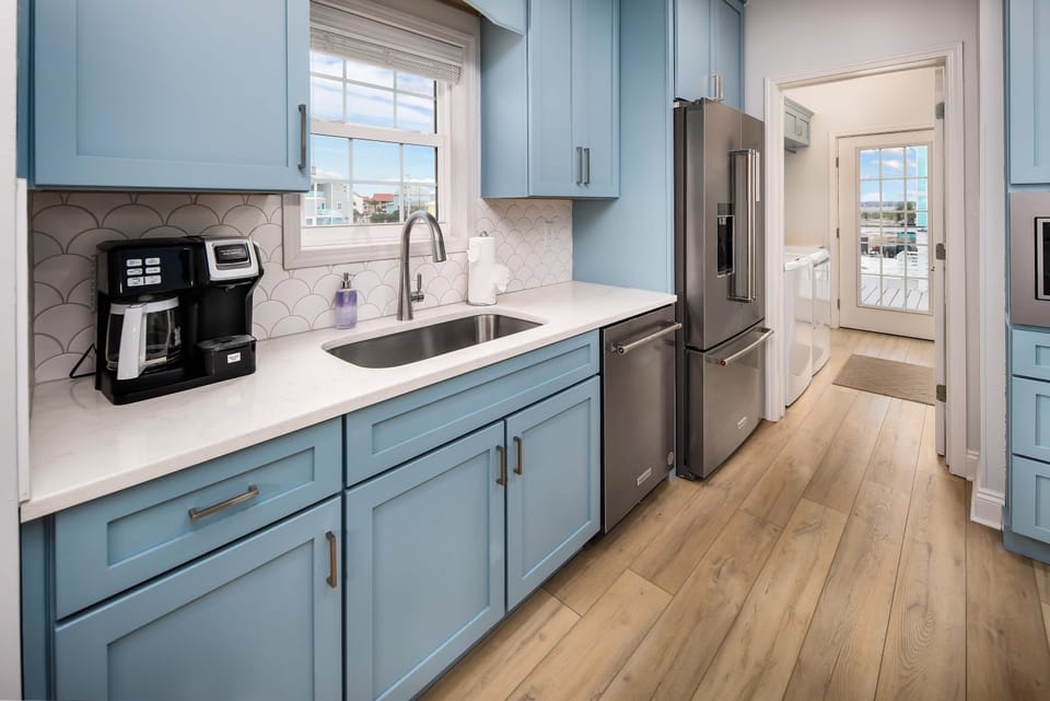 Kitchen and Laundry room with back deck access on the first level
