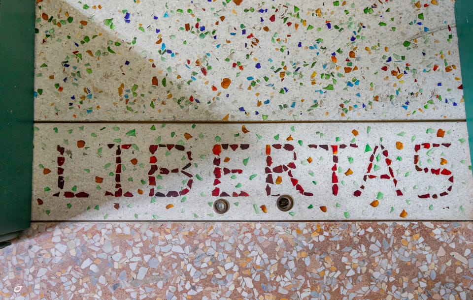 The floors are custom terrazzo in glass and stone