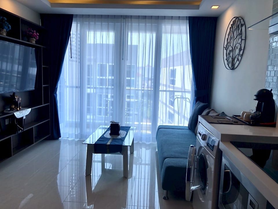 Open Plan kitchen, Washing Machine, glass coffee table etc.