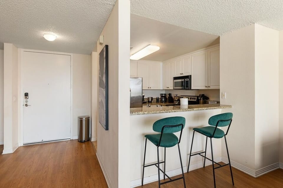 Convenient breakfast bar with seating is perfect for casual dining.