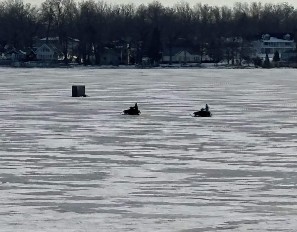 Ice fishing and snowmobiling! Always fun on the lake.