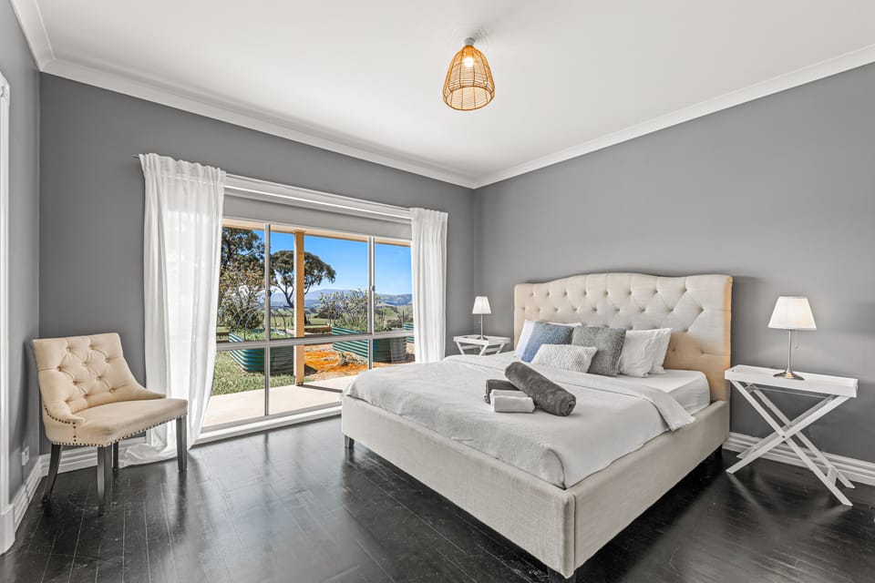 Farmhouse master bedroom with king bed and en-suite